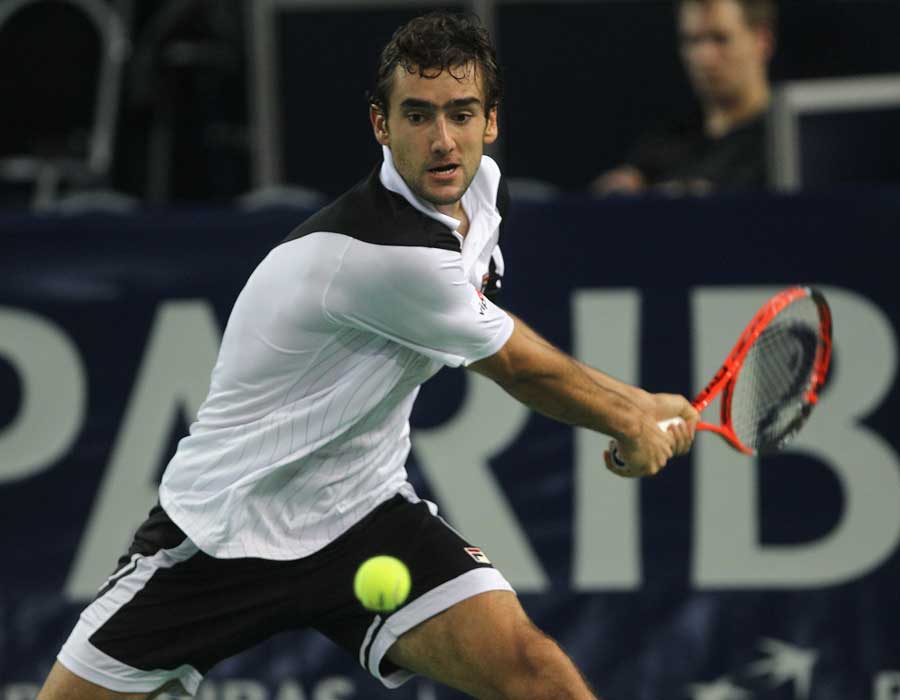 Marin Cilic winds up for a backhand