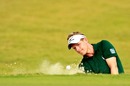 Luke Donald chips out of the bunker