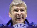 Arsene Wenger smiles during a press conference
