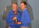 Colin Montgomerie and Ian Poulter get their hands on the Ryder Cup