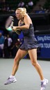 Caroline Wozniacki plays a backhand against Anastasia Pavlyuchenkova
