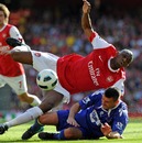 Abou Diaby is tackled by Paul Robinson