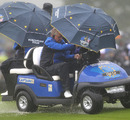 Colin Montgomerie shelters from the rain