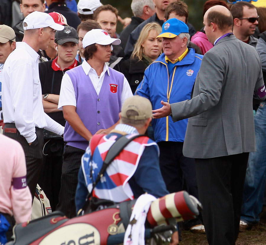 Rickie Fowler and Jim Furyk chat to the referee