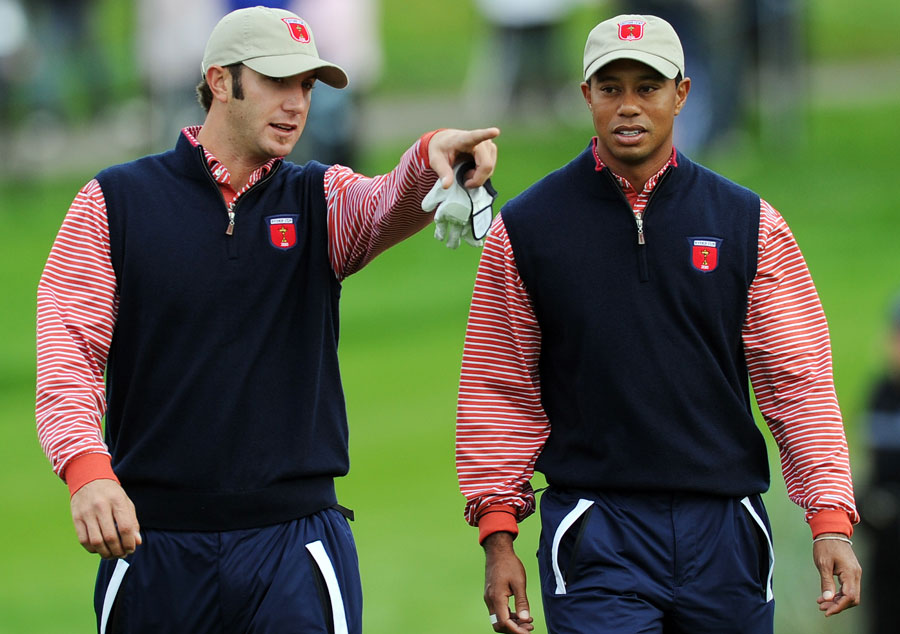 Dustin Johnson gives Tiger Woods a few tips