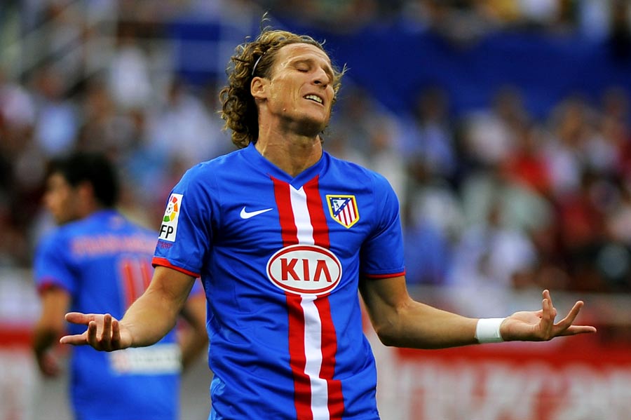 Diego Forlan reacts after misplacing a pass