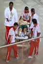 Pierre Bernard Esterhuizen is stretchered off after his tumble during the Men's Keirin