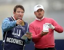 Graeme McDowell and his caddie assess his options