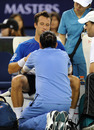 Philip Kohlschreiber is treated by the trainer