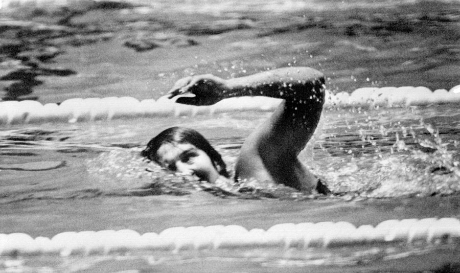 Australian swimmer Dawn Fraser won the 100 m freestyle for the third time in a row
