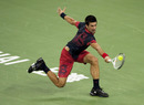 Novak Djokovic stretches for a backhand