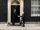 Prime Minister David Cameron greets FIFA president Sepp Blatter