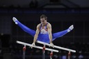 Daniel Keatings performs on the parallel bars