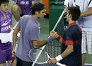 Roger Federer and Novak Djokovic shake hands