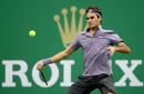 Roger Federer prepares to return