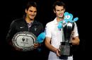 Andy Murray and Roger Federer pose with their trophies