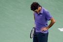 Roger Federer stares solemnly at the court