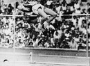 Dick Fosbury clears the bar and sets an Olympic record 