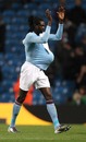 Emmanuel Adebayor walks off with the match ball 