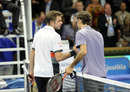 Roger Federer shakes hands with Stanislas Wawrinka after his win