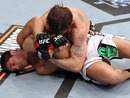 Tom Lawlor looks to improve position against Patrick Cote