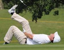 Hugh Grant limbers up before his round