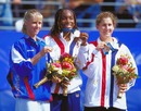 Elena Dementieva, Venus Williams and Monica Seles show off their Olympic medals