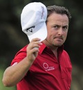 Graeme McDowell salutes the crowd