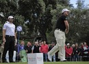 Graeme McDowell tees off watched by Gareth Maybin