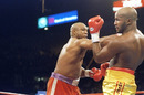 George Foreman lands a straight right on Michael Moorer 