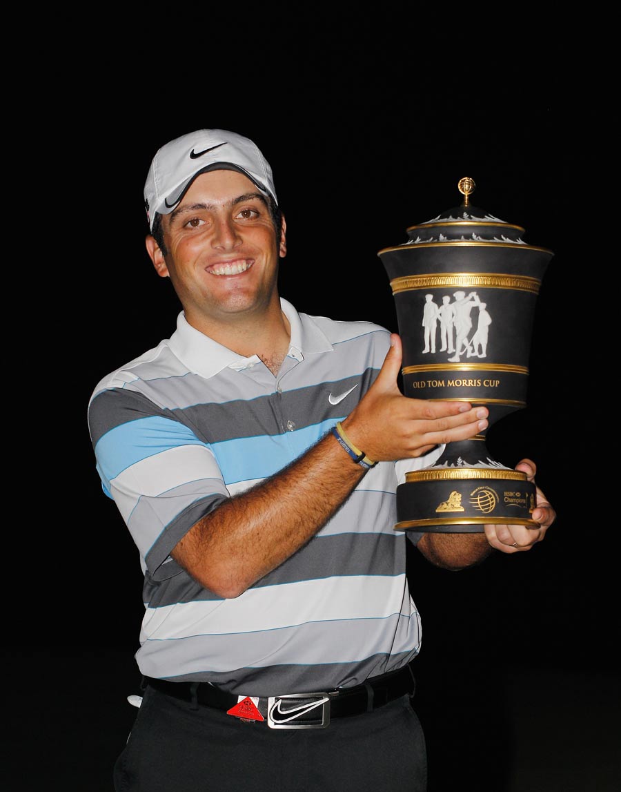 Francesco Molinari poses with his trophy