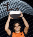 David Ferrer holds his trophy aloft