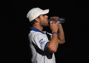 Andy Roddick takes a drink