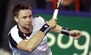 Robin Soderling hits a return to Andy Roddick