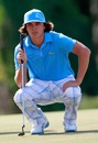 Rickie Fowler lines up a putt