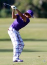 Rickie Fowler hits a shot on the first hole