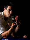 Mitchell Johnson poses with a replica Ashes urn