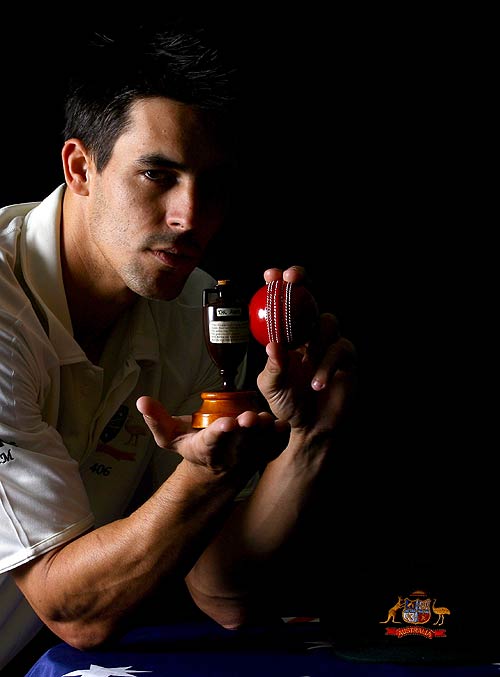 Mitchell Johnson poses with a replica Ashes urn
