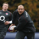 Mike Tindall passes the ball during an England training session