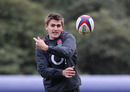 Toby Flood flicks a pass during an England training session