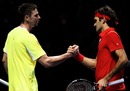 Robin Soderling congratulates Roger Federer