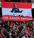 Arsenal fans unfurl a banner in support of the injured Aaron Ramsey
