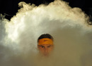 Rafael Nadal makes his way through the smoke