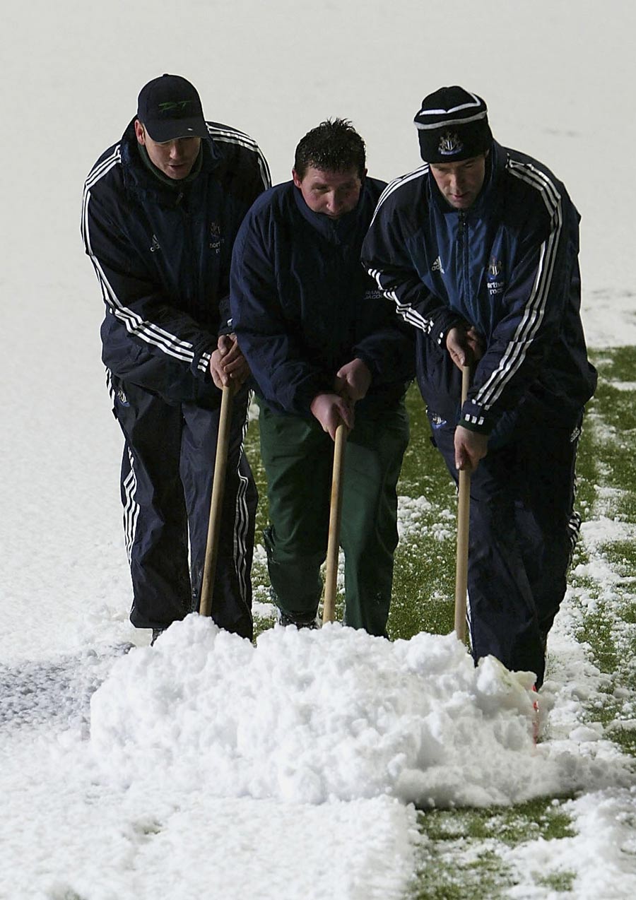 Newcastle groundstaff shovel snow