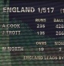 The scoreboard shows England's second innings score of 517 for declared