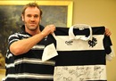 Anton van Zyl shows off a signed Barbarians shirt