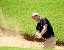 Ross Fisher plays from a bunker
