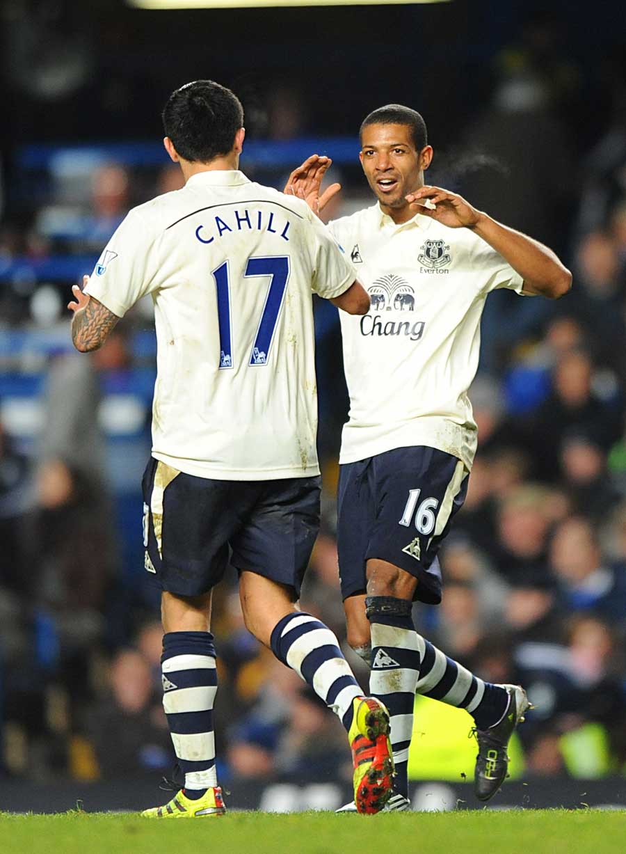 Tim Cahill congratulates Jermaine Beckford after equalising