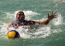 Players compete for the ball in the waterpolo
