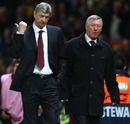 Arsene Wenger gestures as he walks off with Sir Alex Ferguson